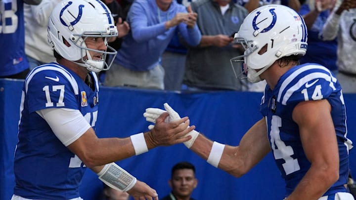 Oct 12, 2025; Indianapolis, Indiana, USA; Indianapolis Colts quarterback Daniel Jones (17) celebrates with wide receiver Alec Pierce (14) after Jones scores a touchdown during a game against the Arizona Cardinals at Lucas Oil Stadium. Mandatory Credit: Christine Tannous-USA TODAY Network via Imagn Images