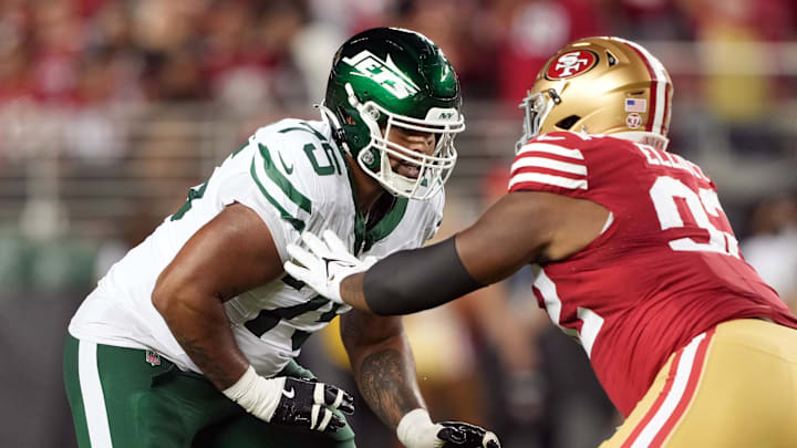 Sep 9, 2024; Santa Clara, California, USA; New York Jets guard Alijah Vera-Tucker (75) blocks against San Francisco 49ers defensive tackle Jordan Elliott (right) during the fourth quarter at Levi's Stadium. Mandatory Credit: Darren Yamashita-Imagn Images