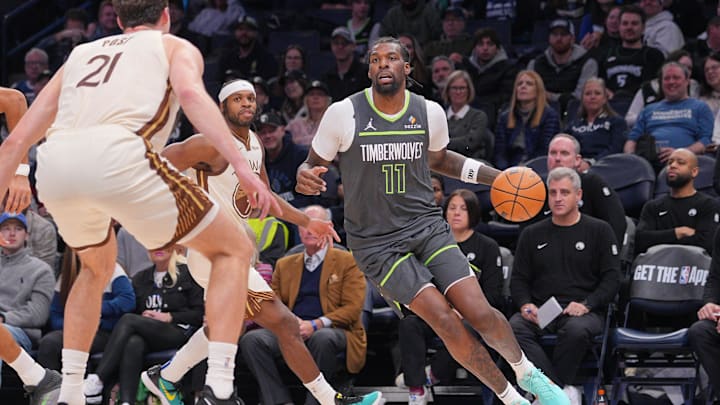Jan 26, 2026; Minneapolis, Minnesota, USA; Minnesota Timberwolves center Naz Reid (11) dribbles against the Golden State Warriors in the fourth quarter at Target Center.