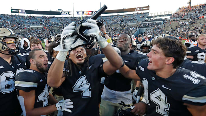 Purdue Boilermakers wide receiver Deion Burks (4) holds the Purdue Cannon after the game against the Illinois Fighting Illini