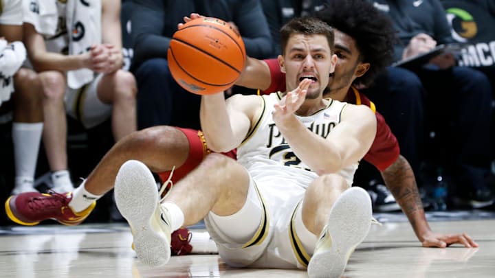 Purdue Boilermakers forward Camden Heide (23) and USC Trojans forward Saint Thomas (0) dive for the ball 
