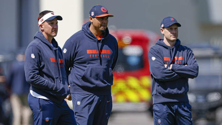 May 9, 2025; Lake Forest, IL, USA; Chicago Bears defensive coordinator Dennis Allen (L), general manager Ryan Poles (C) and head coach Ben Johnson (R) observe during the Rookie Minicamp at Halas Hall. Mandatory Credit: Kamil Krzaczynski-Imagn Images