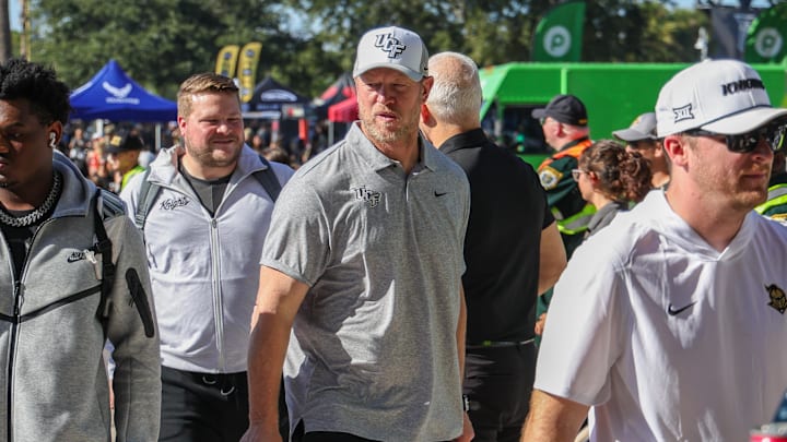 Nov 22, 2025; Orlando, Florida, USA; UCF Knights head coach Scott Frost walks into the venue before the game against the Oklahoma State Cowboys at Acrisure Bounce House. Mandatory Credit: Mike Watters-Imagn Images
