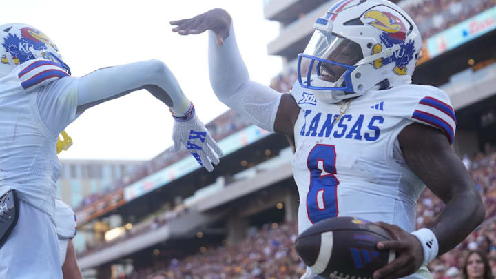 Kansas quarterback Jalon Daniels (6) celebrates his touchdown run against Arizona State at Mountain America Stadium on Oct. 5, 2024.