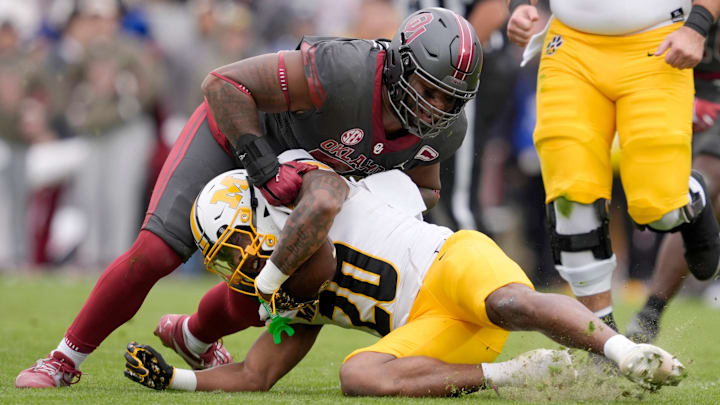 Oklahoma Sooners defensive lineman Gracen Halton (56) brings down Missouri Tigers running back Jamal Roberts (20) during a college football game between the University of Oklahoma Sooners (OU) and the Missouri Tigers at Gaylord Family Ð Oklahoma Memorial Stadium in Norman, Okla., on Saturday, Nov. 22, 2025. Oklahoma won 17-6. Oklahoma Sooners defensive lineman Gracen Halton (56) brings down Missouri Tigers running back Jamal Roberts (20) during a college football game between the University of Oklahoma Sooners (OU) and the Missouri Tigers at Gaylord Family Ð Oklahoma Memorial Stadium in Norman, Okla., on Saturday, Nov. 22, 2025. Oklahoma won 17-6.