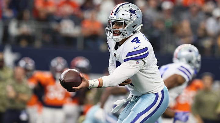 Dallas Cowboys quarterback Dak Prescott hands off the ball against the Denver Broncos. Dallas Cowboys quarterback Dak Prescott hands off the ball against the Denver Broncos.