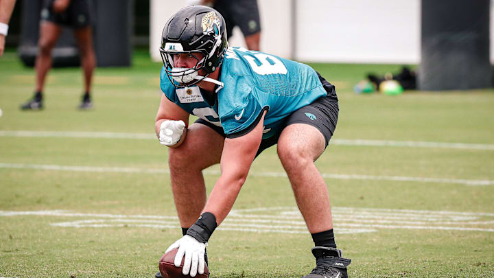 May 10, 2025; Jacksonville, FL, USA; Jacksonville Jaguars offensive lineman Wyatt Milum (64) prepares to snap the ball during rookie minicamp at Miller Electric Center. Mandatory Credit: Travis Register-Imagn Images