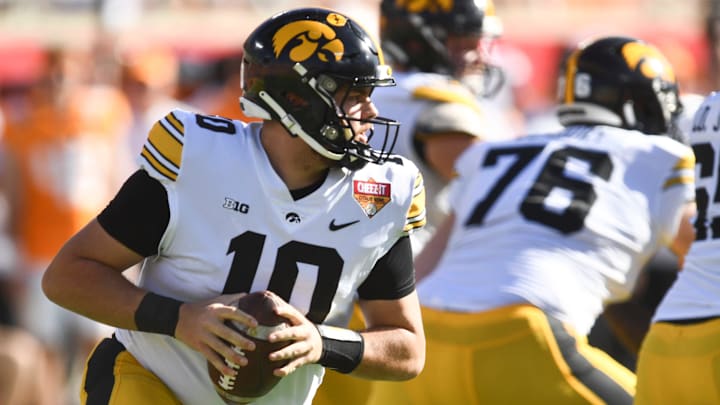 Iowa quarterback Deacon Hill (10) looks to pass the ball during the Citrus Bowl.