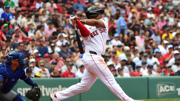 Jul 14, 2024; Boston, Massachusetts, USA;  Boston Red Sox third baseman Rafael Devers (11) hits a double during the third inning against the Kansas City Royals at Fenway Park. Mandatory Credit: Bob DeChiara-USA TODAY Sports