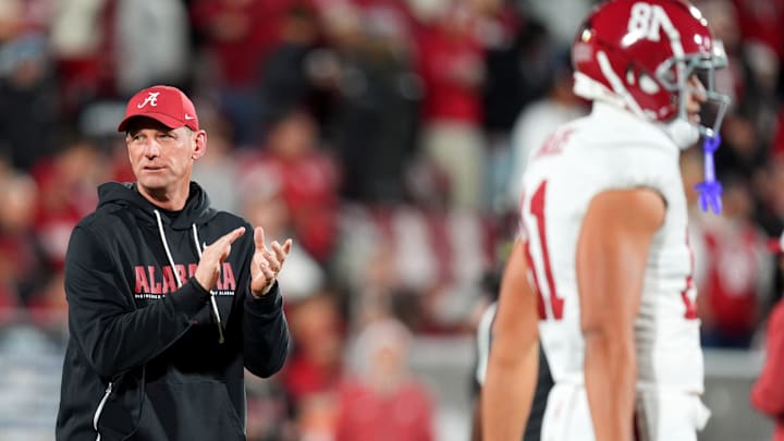 Alabama head football coach Kalen DeBoer watches players warm up before the College Football Playoff game between the University of Oklahoma Sooners (OU) and the Alabama Crimson Tide at the Gaylord Family – Oklahoma Memorial Stadium in Norman, Okla., Friday Dec. 19, 2025.