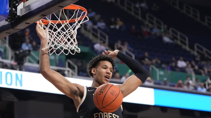 Mar 8, 2023; Greensboro, NC, USA; Wake Forest Demon Deacons forward Bobi Klintman (34) scores in the first half of the second round at Greensboro Coliseum. Mandatory Credit: Bob Donnan-USA TODAY Sports