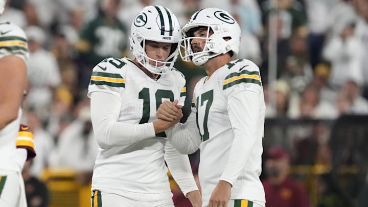 Sep 11, 2025; Green Bay, Wisconsin, USA; Green Bay Packers place kicker Brandon McManus (17) reacts with punter Daniel Whelan (19) after a field goal in the fourth quarter against the Washington Commanders at Lambeau Field. Mandatory Credit: Jeff Hanisch-Imagn Images