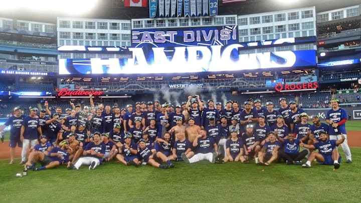 Toronto Blue Jays players and staff pose for a team picture after defeating the Tampa Bay Rays and clinching first place in the American League East Division at Rogers Centre.