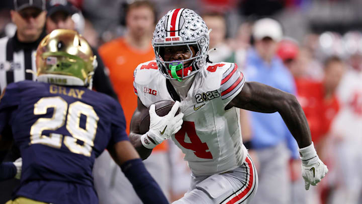 Jan 20, 2025; Atlanta, GA, USA; Ohio State Buckeyes wide receiver Jeremiah Smith (4) runs with the ball against the Notre Dame Fighting Irish during the first half the CFP National Championship college football game at Mercedes-Benz Stadium. Mandatory Credit: Brett Davis-Imagn Images Jan 20, 2025; Atlanta, GA, USA; Ohio State Buckeyes wide receiver Jeremiah Smith (4) runs with the ball against the Notre Dame Fighting Irish during the first half the CFP National Championship college football game at Mercedes-Benz Stadium. Mandatory Credit: Brett Davis-Imagn Images