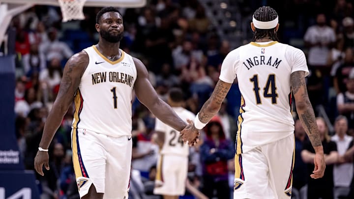 Nov 1, 2024; New Orleans, Louisiana, USA;  New Orleans Pelicans forward Brandon Ingram (14) slaps hands with forward Zion Williamson (1) after a play against the Indiana Pacers during the second half at Smoothie King Center. Mandatory Credit: Stephen Lew-Imagn Images