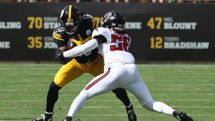 Sep 13, 2026; Pittsburgh, Pennsylvania, USA;  Pittsburgh Steelers running back Rico Dowdle (13) runs after a catch against Atlanta Falcons linebacker Harold Perkins Jr. (56) during the third quarter at Acrisure Stadium.  Mandatory Credit: Charles LeClaire-Imagn Images