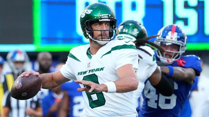 Aug 26, 2023; East Rutherford, New Jersey, USA;   New York Jets quarterback Aaron Rodgers (8) throws against the Giants at MetLife Stadium. Mandatory Credit: Robert Deutsch-Imagn Images