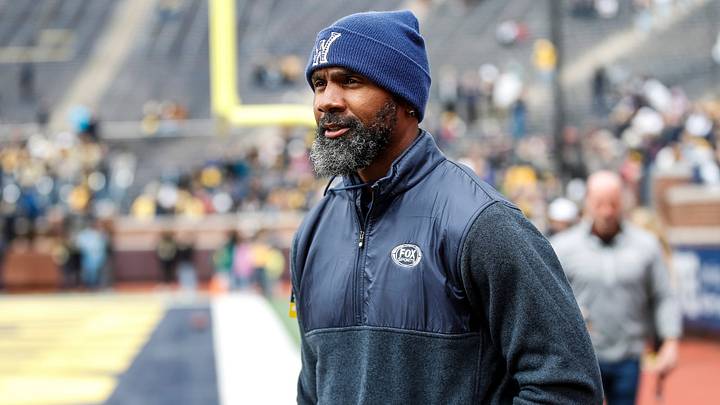 Michigan legend Charles Woodson waves at fans during warmup at the spring game at Michigan Stadium in Ann Arbor on Saturday, April 20, 2024.