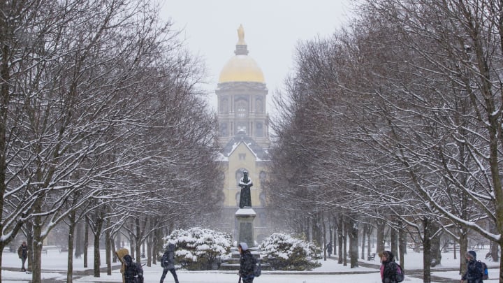 Feb. 26, 2020; South Bend, IN, USA; People make their way along a path near the administration building, known as \"The Golden Dome\" Wednesday, Feb. 26, 2020 on the campus of Notre Dame in South Bend, Indiana. Mandatory Credit: Michael Caterina/South Bend Tribune via USA TODAY NETWORK