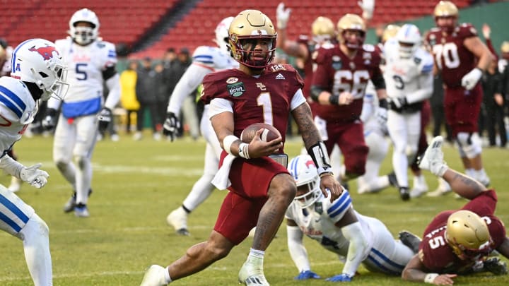 Dec 28, 2023; Boston, MA, USA; Boston College Eagles quarterback Thomas Castellanos (1) runs in for a touchdown during the second half against the Southern Methodist Mustangs at Fenway Park. Mandatory Credit: Eric Canha-USA TODAY Sports