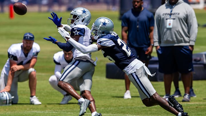 Jul 31, 2023; Oxnard, CA, USA; Dallas Cowboys cornerback Nahshon Wright (25) breaks up a pass intended for wide receiver Brandin Cooks (3) during training camp at the Marriott Residence Inn-River Ridge playing fields. Mandatory Credit: Jason Parkhurst-USA TODAY Sports