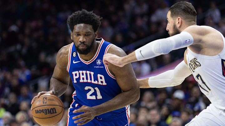 Jan 2, 2023; Philadelphia, Pennsylvania, USA; Philadelphia 76ers center Joel Embiid (21) dribbles the ball against New Orleans Pelicans center Jonas Valanciunas (17) during the first quarter at Wells Fargo Center. Mandatory Credit: Bill Streicher-Imagn Images Jan 2, 2023; Philadelphia, Pennsylvania, USA; Philadelphia 76ers center Joel Embiid (21) dribbles the ball against New Orleans Pelicans center Jonas Valanciunas (17) during the first quarter at Wells Fargo Center. Mandatory Credit: Bill Streicher-Imagn Images