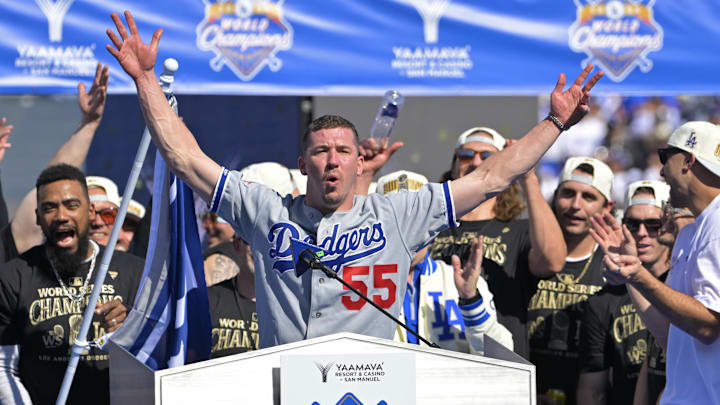Nov 1, 2024; Los Angeles, CA, USA; Los Angeles Dodgers starting pitcher Walker Buehler (21) speaks to fans during the World Series Championship Celebration at Dodger Stadium. Nov 1, 2024; Los Angeles, CA, USA; Los Angeles Dodgers starting pitcher Walker Buehler (21) speaks to fans during the World Series Championship Celebration at Dodger Stadium.