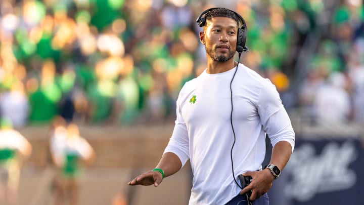 Oct 4, 2025; South Bend, Indiana, USA; Notre Dame head football coach Marcus Freeman adjusts his radio against the Boise State Broncos at Notre Dame Stadium. Mandatory Credit: Michael Caterina-Imagn Images Oct 4, 2025; South Bend, Indiana, USA; Notre Dame head football coach Marcus Freeman adjusts his radio against the Boise State Broncos at Notre Dame Stadium. Mandatory Credit: Michael Caterina-Imagn Images
