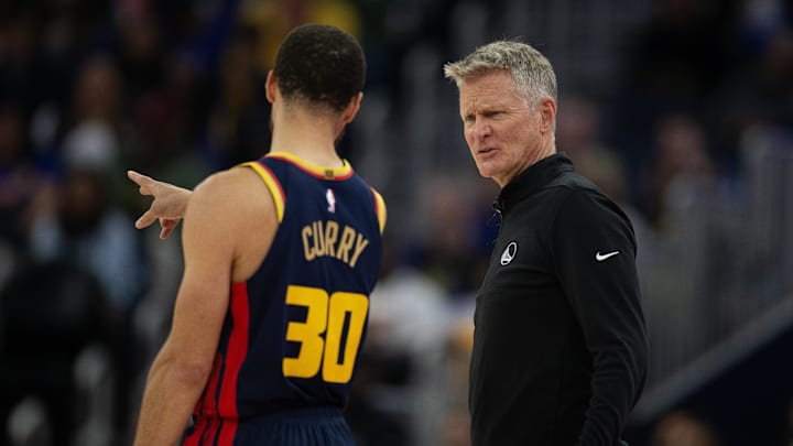 Mar 13, 2025; San Francisco, California, USA; Golden State Warriors head coach Steve Kerr confers with guard Stephen Curry (30) during the second quarter against the Sacramento Kings at Chase Center. Mandatory Credit: D. Ross Cameron-Imagn Images Mar 13, 2025; San Francisco, California, USA; Golden State Warriors head coach Steve Kerr confers with guard Stephen Curry (30) during the second quarter against the Sacramento Kings at Chase Center. Mandatory Credit: D. Ross Cameron-Imagn Images