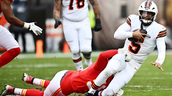 Dec 15, 2024; Cleveland, Ohio, USA; Kansas City Chiefs defensive end George Karlaftis (56) tackles Cleveland Browns quarterback Jameis Winston (5) during the first quarter at Huntington Bank Field. Mandatory Credit: Ken Blaze-Imagn Images