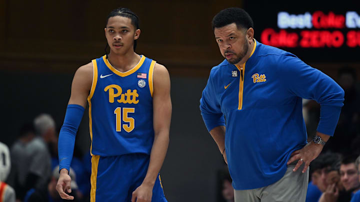 Jan 7, 2025; Durham, North Carolina, USA; Pitt Panthers head coach Jeff Capel (right) talks to guard Jaland Lowe (15) during the first half against the Duke Blue Devils at Cameron Indoor Stadium. Mandatory Credit: Rob Kinnan-Imagn Images
