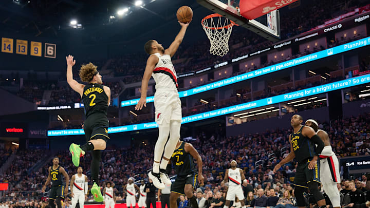 Nov 21, 2025; San Francisco, California, USA; Portland Trail Blazers guard Caleb Love (2) shoots the ball against Golden State Warriors guard Brandin Podziemski (2) during the second quarter at Chase Center.