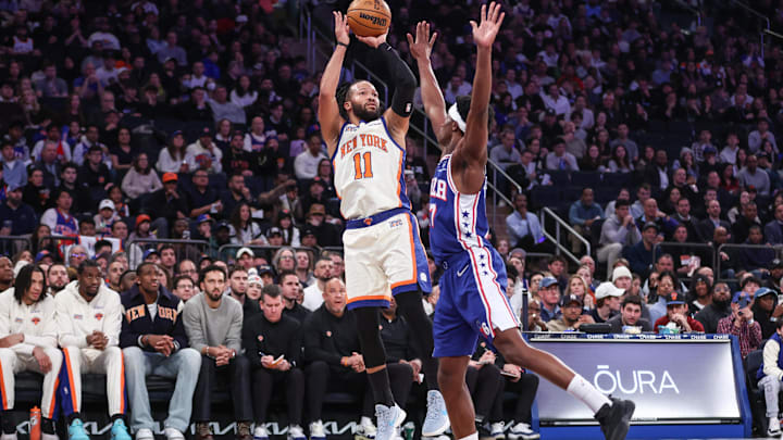 Jan 3, 2026; New York, New York, USA; New York Knicks guard Jalen Brunson (11) shoots the ball defended by Philadelphia 76ers guard Vj Edgecombe (77) in the first quarter at Madison Square Garden. Mandatory Credit: Wendell Cruz-Imagn Images