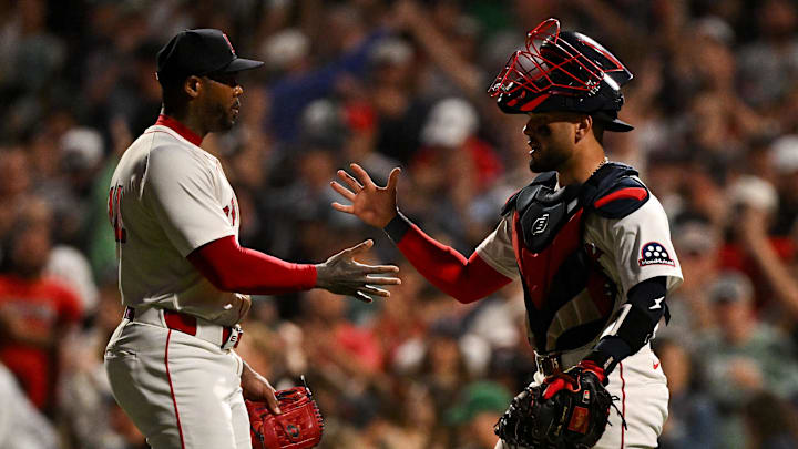 Sep 14, 2025; Boston, Massachusetts, USA; Boston Red Sox relief pitcher Aroldis Chapman (44) high-fives catcher Carlos Narvaez (75) after a game against the New York Yankees at Fenway Park. Mandatory Credit: Brian Fluharty-Imagn Images