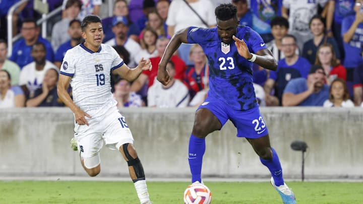 Mar 27, 2023; Orlando, Florida, USA; El Salvador forward Kevin Reyes (19) chases United States of America forward Daryl Dike (23) during the first half at Exploria Stadium. Mandatory Credit: Reinhold Matay-Imagn Images