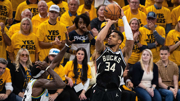 Apr 29, 2025; Indianapolis, Indiana, USA; Milwaukee Bucks forward Giannis Antetokounmpo (34) shoots the ball while  Indiana Pacers forward Pascal Siakam (43) defends during game five of the first round for the 2024 NBA Playoffs at Gainbridge Fieldhouse. Mandatory Credit: Trevor Ruszkowski-Imagn Images