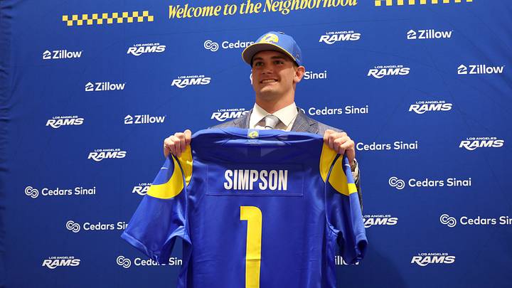 Apr 24, 2026; Inglewood, CA, USA; Los Angeles Rams first-round draft pick Ty Simpson poses with his jersey during a press conference at Code Next at Hollywood Park. Mandatory Credit: Kiyoshi Mio-Imagn Images Apr 24, 2026; Inglewood, CA, USA; Los Angeles Rams first-round draft pick Ty Simpson poses with his jersey during a press conference at Code Next at Hollywood Park. Mandatory Credit: Kiyoshi Mio-Imagn Images