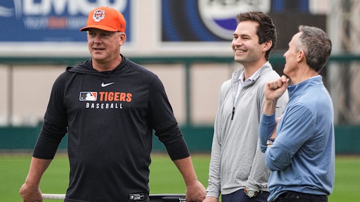 Detroit Tigers manager A.J. Hinch, left, talks to president of baseball operation Scott Harris, center, and team owner Chris Ilitch during spring training at Joker Marchant Stadium in Lakeland, Fla. on Thursday, Feb. 20, 2025.