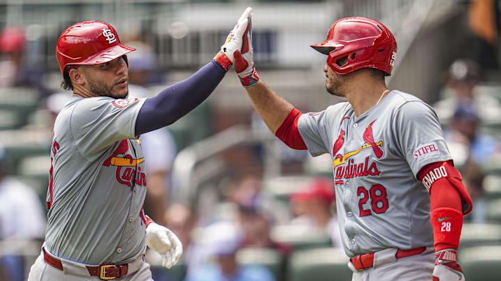 Jul 21, 2024; Cumberland, Georgia, USA; St. Louis Cardinals catcher Willson Contreras (40) reacts with third baseman Nolan Arenado (28) after hitting a home run against the Atlanta Braves during the eighth inning at Truist Park. Mandatory Credit: Dale Zanine-Imagn Images
