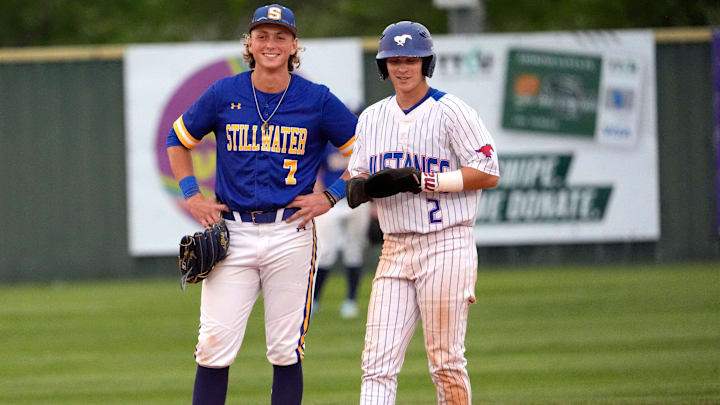 Fort Cobb-Broxton's Eli Willits talks with Stillwater's Ethan Holliday during the high school baseball game between Fort Cobb-Broxton and Stillwater at Edmond Santa Fe High School in Edmond, Okla., Friday, April, 18, 2025.