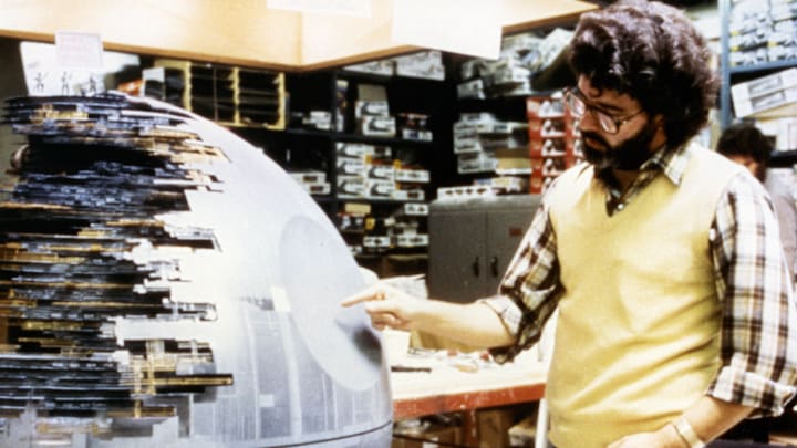 George Lucas on set of Star Wars: A New Hope with Death Star model