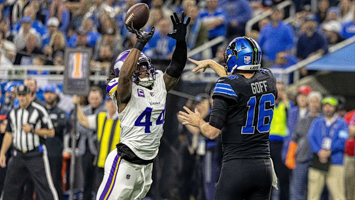 Jan 5, 2025; Detroit, Michigan, USA; Minnesota Vikings safety Josh Metellus (44) tips a pass by Detroit Lions quarterback Jared Goff (16) which was intercepted by Minnesota Vikings linebacker Ivan Pace Jr. (0) during the first half at Ford Field.