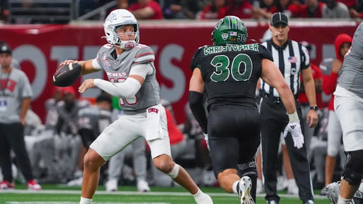 Dec 23, 2025; Frisco, TX, USA;  UNLV Rebels quarterback Anthony Colandrea (10) stands in the pocket as Ohio Bobcats linebacker Charlie Christopher (30) defends during the second half at the Ford Center at The Star. 