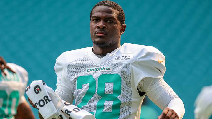 Miami Dolphins running back De'von Achane looks on from the field during practice at Hard Rock Stadium. Miami Dolphins running back De'von Achane looks on from the field during practice at Hard Rock Stadium.