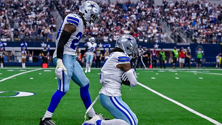 Dallas Cowboys cornerback DaRon Bland (26) and cornerback Trevon Diggs (7) celebrate after Diggs intercepts a pass against the Washington Commanders during the game at AT&T Stadium. Mandatory Credit: Jerome Miron-USA TODAY Sports