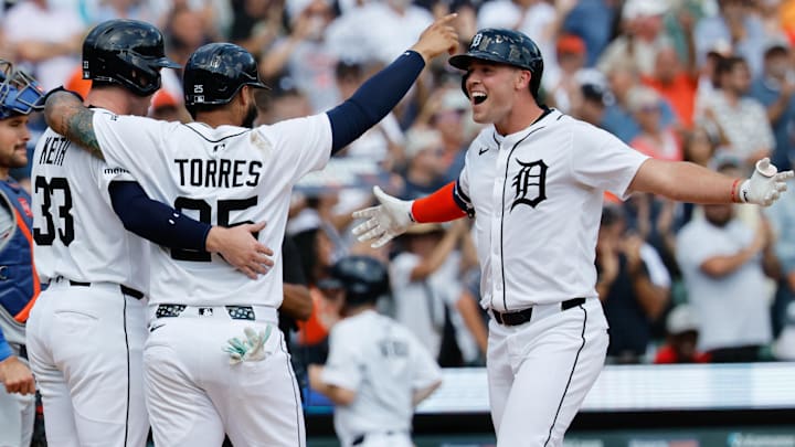 Detroit Tigers outfielder Kerry Carpenter (30) celebrates with second base Gleyber Torres (25) and second base Colt Keith (33) after he hits a three run home run in the seventh inning against the New York Mets at Comerica Park. 
