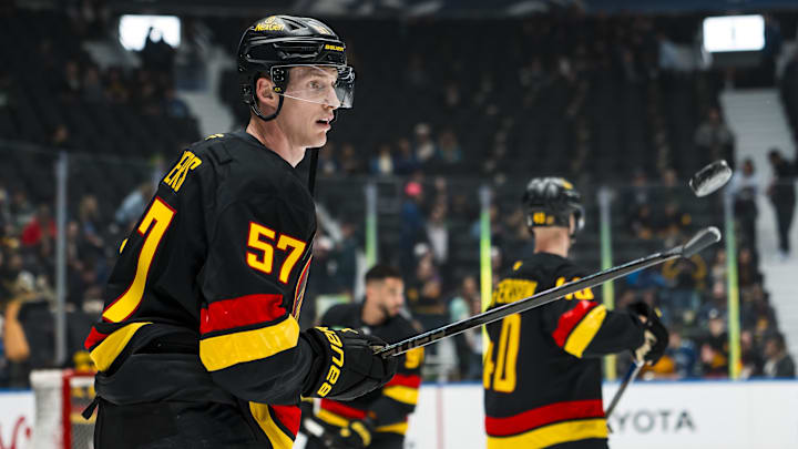 Mar 2, 2026; Vancouver, British Columbia, CAN; Vancouver Canucks defenseman Tyler Myers (57) handles the puck in warm up prior to a game against the Dallas Stars at Rogers Arena. Mandatory Credit: Bob Frid-Imagn Images