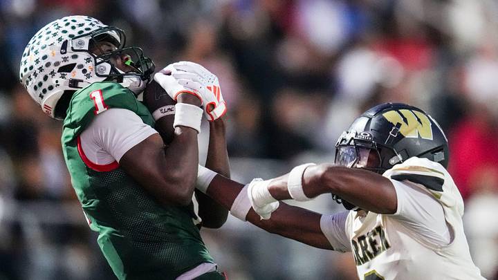 Lawrence North Wildcats Monshun Sales (1) catches a pass against Warren Central Terrell Harris (2) on Friday, Oct. 3, 2025, during a game between the Lawrence North Wildcats and Warren Central at Lawrence North High School in Indianapolis.