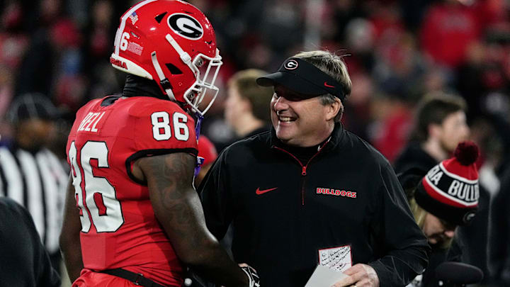 Georgia wide receiver Dillon Bell (86) speaks with Georgia coach Kirby Smart during warm ups before the start of a NCAA college football game against Georgia Tech in Athens, Ga., on Friday, Nov. 29, 2024.