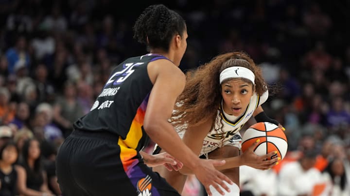 May 27, 2025; Phoenix, Arizona, USA; Chicago Sky forward Angel Reese (5) shields the ball from Phoenix Mercury forward Alyssa Thomas (25) in the first half at Footprint Center. Mandatory Credit: Rick Scuteri-Imagn Images